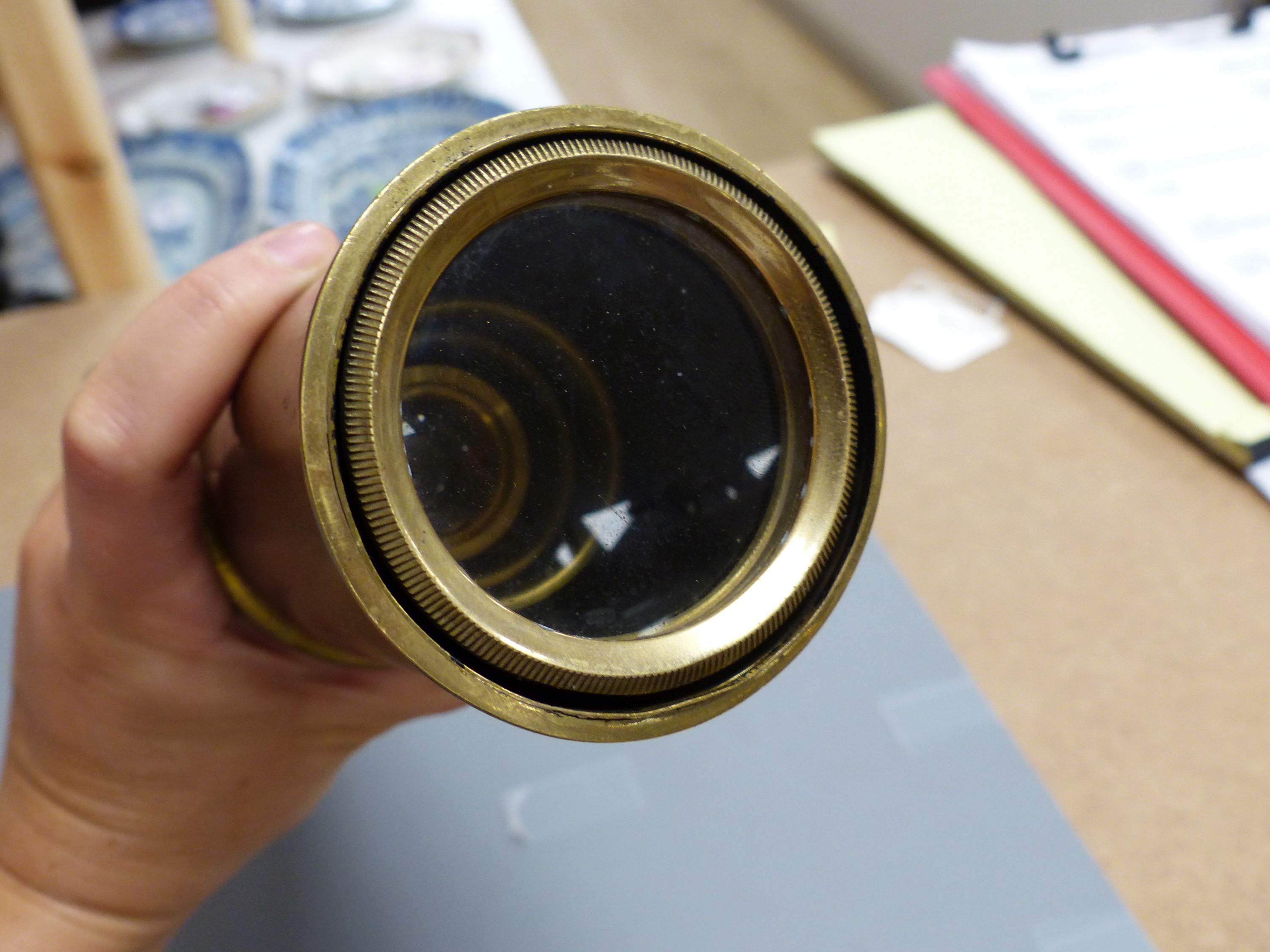 An early 20th century brass three drawer telescope, overall length 90.5cm extended